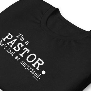 "I'm a Pastor. Don't look so surprised." Unisex t-shirt